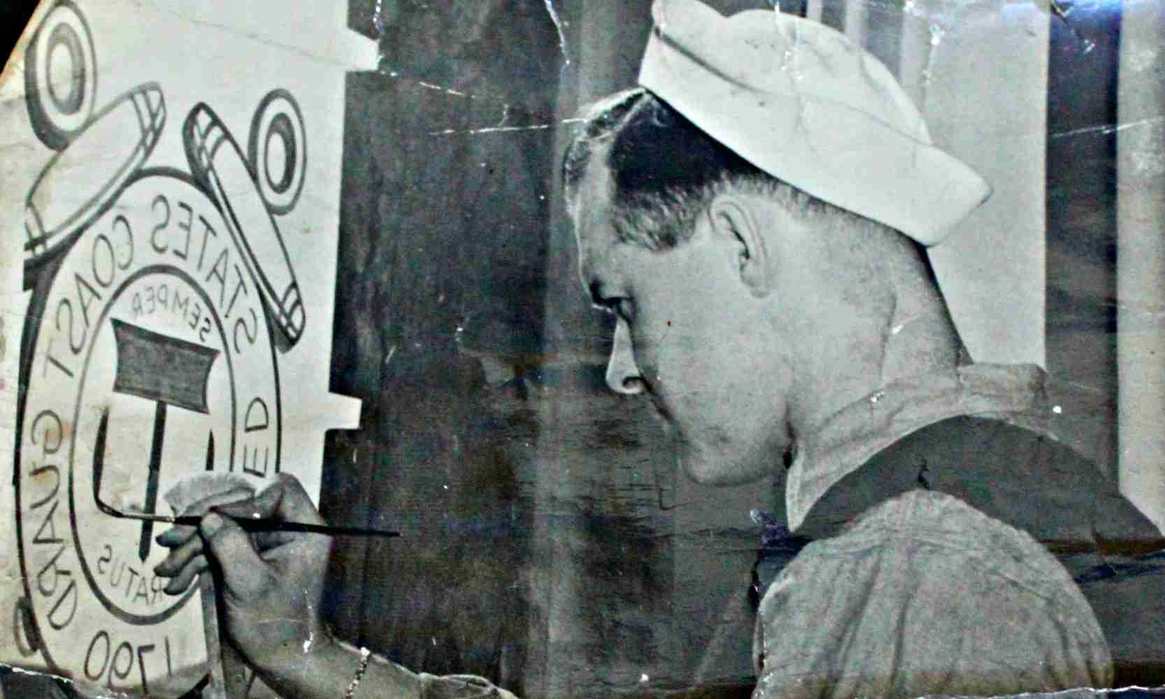 Painting a 1940s window. This indoor job offered a challenge: lettering backwards.