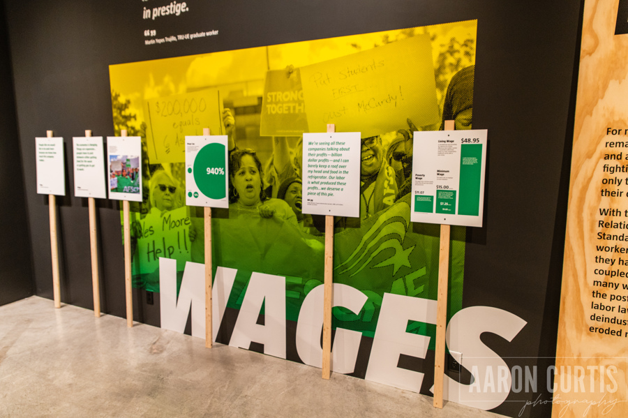 Photo of exhibit panel about wages