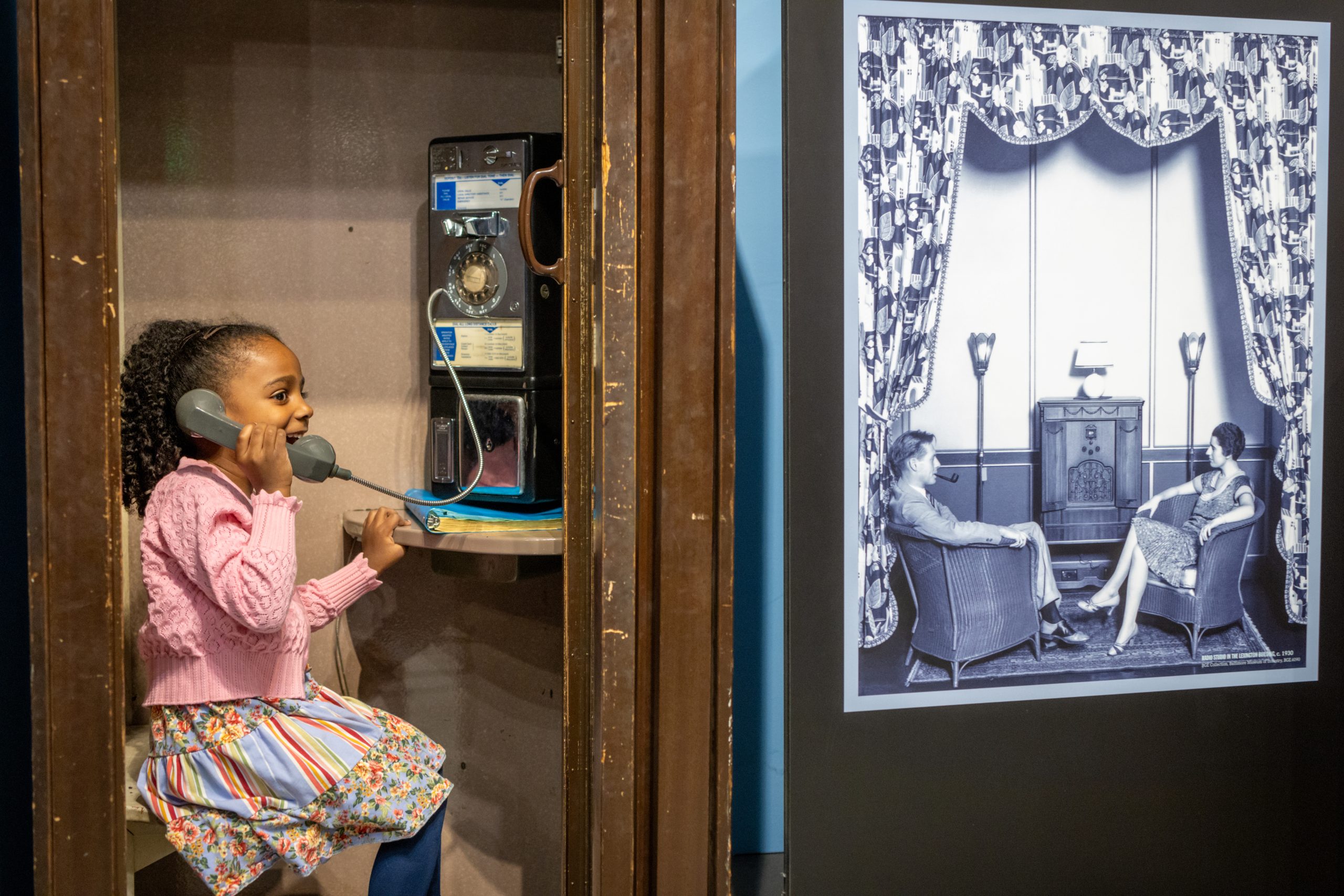 child using old fashioned telephone