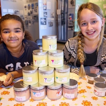 two girls selling products