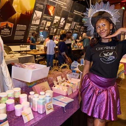 girl selling products at children's business fair